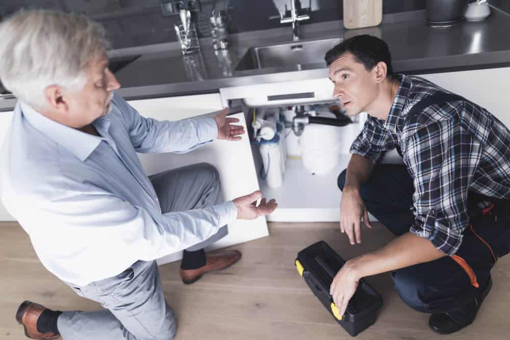 Man Plumber Speaks With A Client